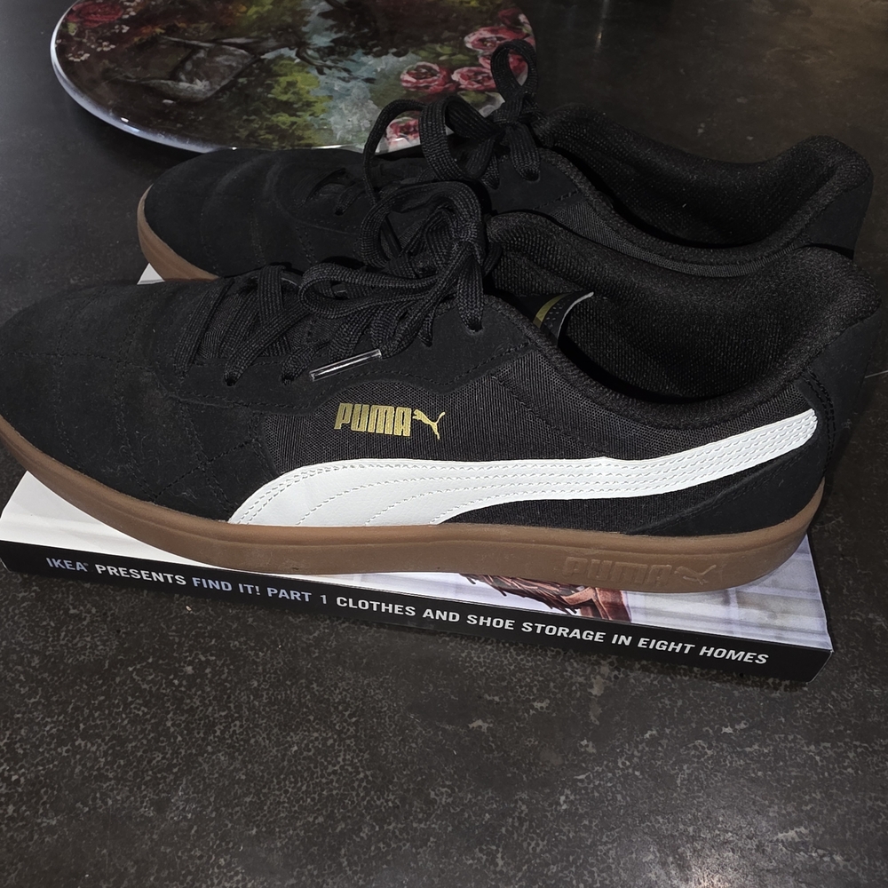 Puma Black Sneakers with White and Gold Accents And Tan Sole.